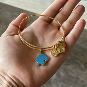 Gold Alex and Ani puzzle piece bracelet